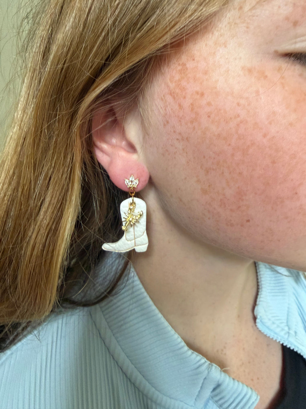 White cowboy boot dangle earrings with gold lobster charm
